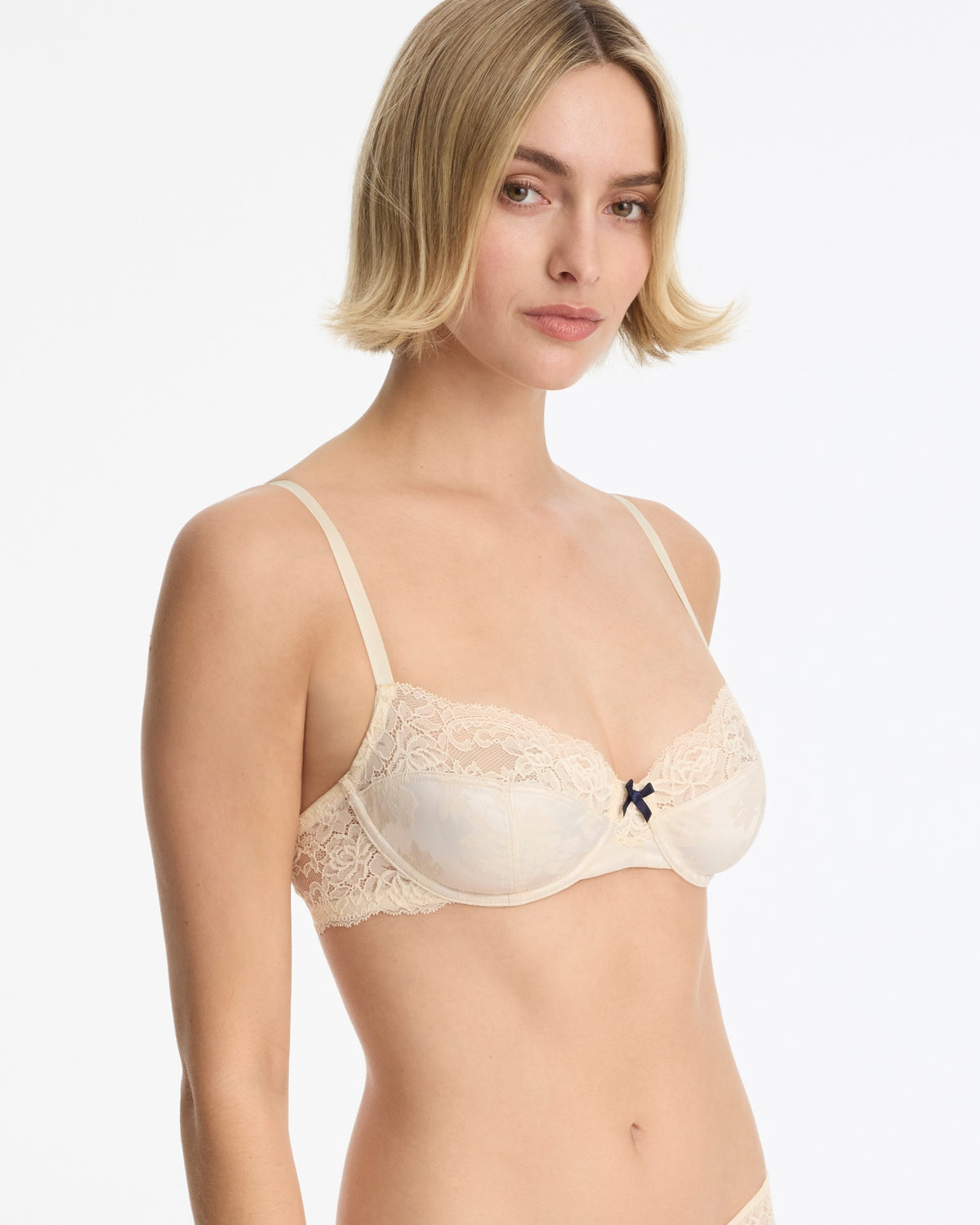 Skarlett Blue Captivate Satin & Lace Balconette Underwire Bra in Candlelight - model three-quarter view in underwire balconette bra with lace cups