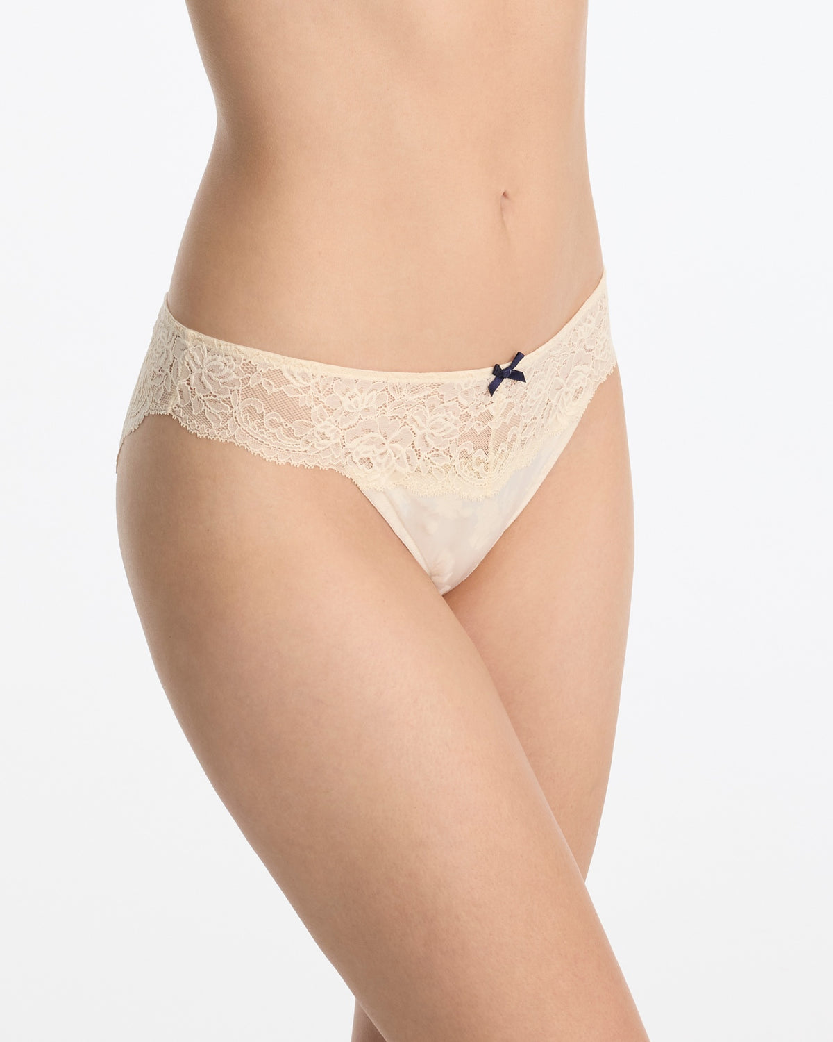 Skarlett Blue Captivate Satin & Lace Bikini in Candlelight - model close-up front view in satin bikini underwear with floral lace trim