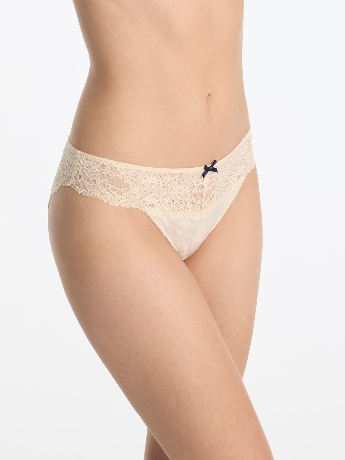 Skarlett Blue Captivate Satin & Lace Bikini in Candlelight - model close-up front view in satin bikini underwear with floral lace trim