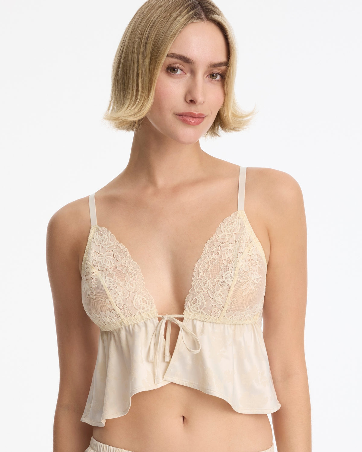 Skarlett Blue Captivate Satin & Lace Flutter Cami in Candlelight - model front view in satin and lace cami with tie-front cups