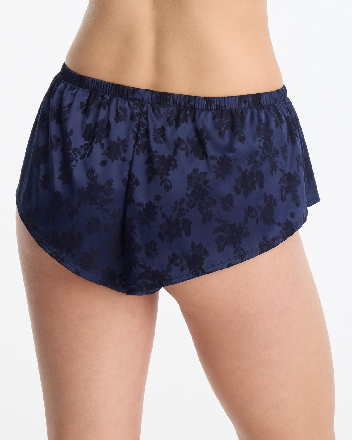 Skarlett Blue Captivate Satin Flutter Short in Midnight - model back view in satin sleep shorts with jacquard floral texture