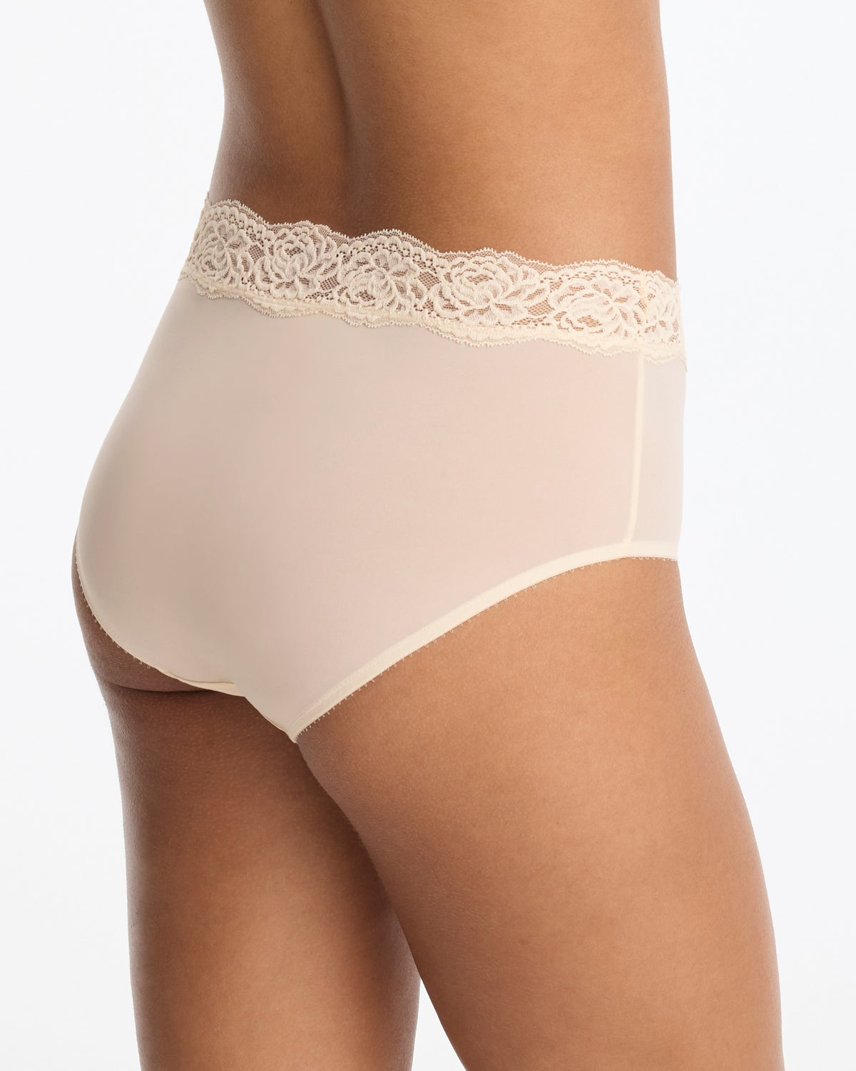 Skarlett Blue Divine Lace Trim Brief in Candlelight - model back three-quarter view in smooth full coverage brief with floral lace waistband