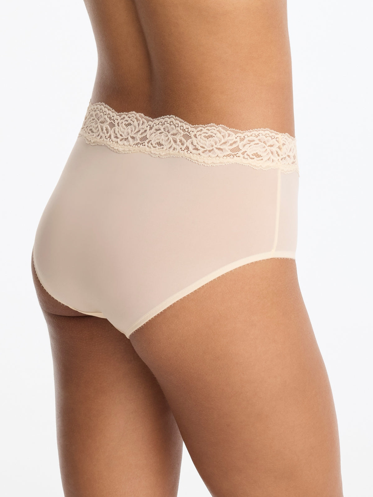 Skarlett Blue Divine Lace Trim Brief in Candlelight - model back three-quarter view in smooth full coverage brief with floral lace waistband