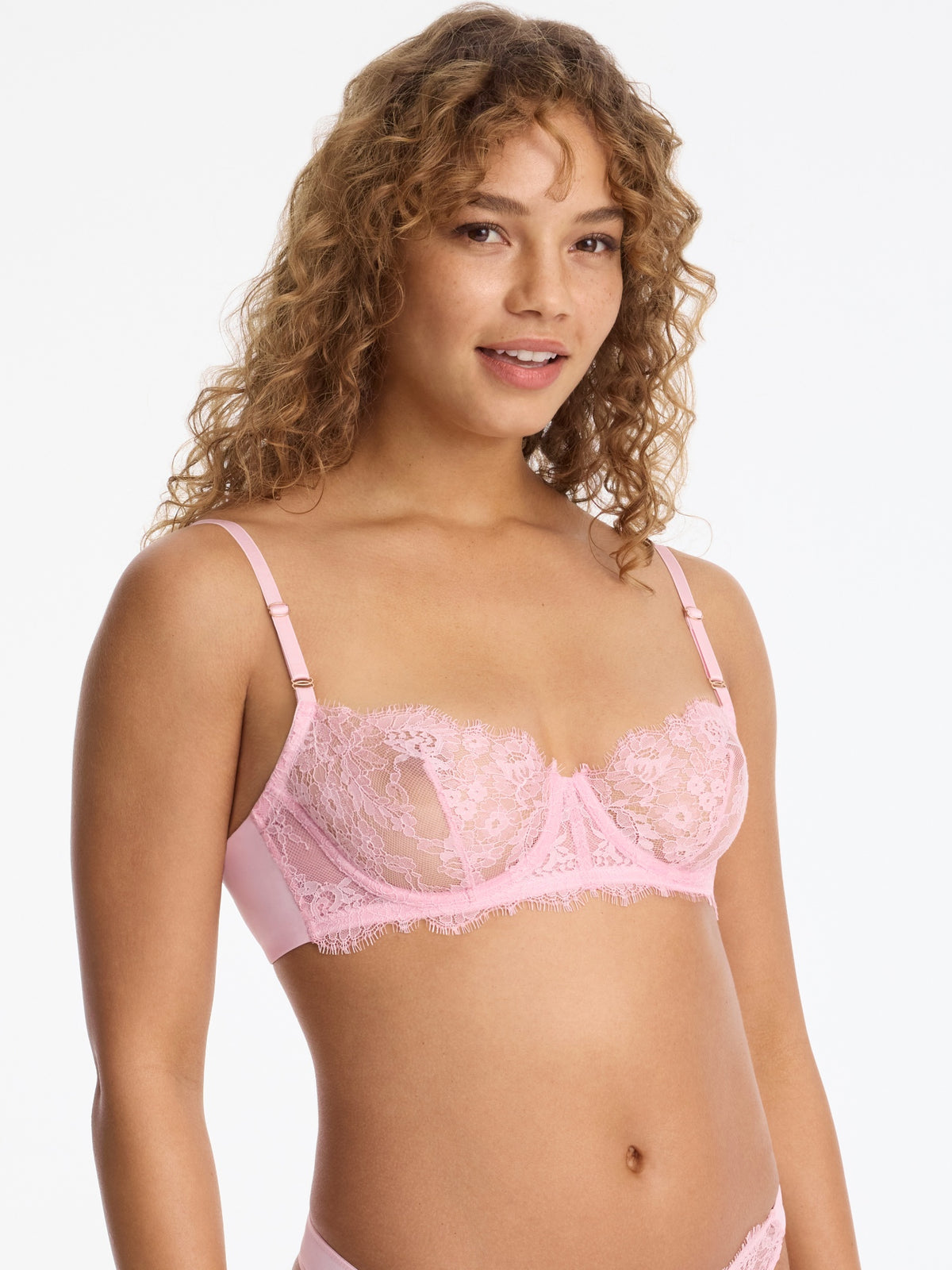 Skarlett Blue Entice Lace Balconette Bra in Strawberry Cream - model three-quarter close-up in sheer lace underwire balconette bra