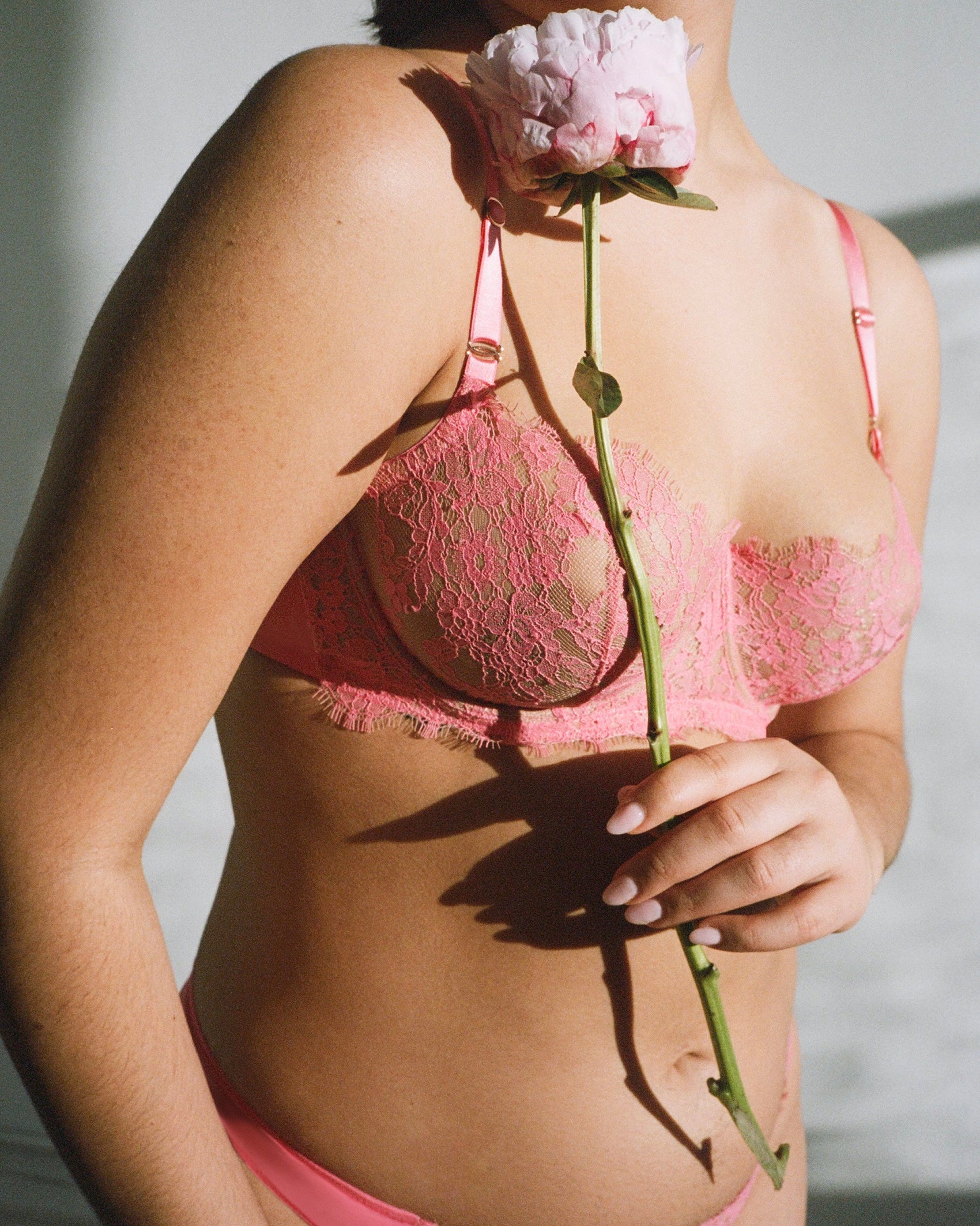 Skarlett Blue Entice Lace Balconette Bra in Rosy/Terra Cotta - Model in a coral pink lingerie set