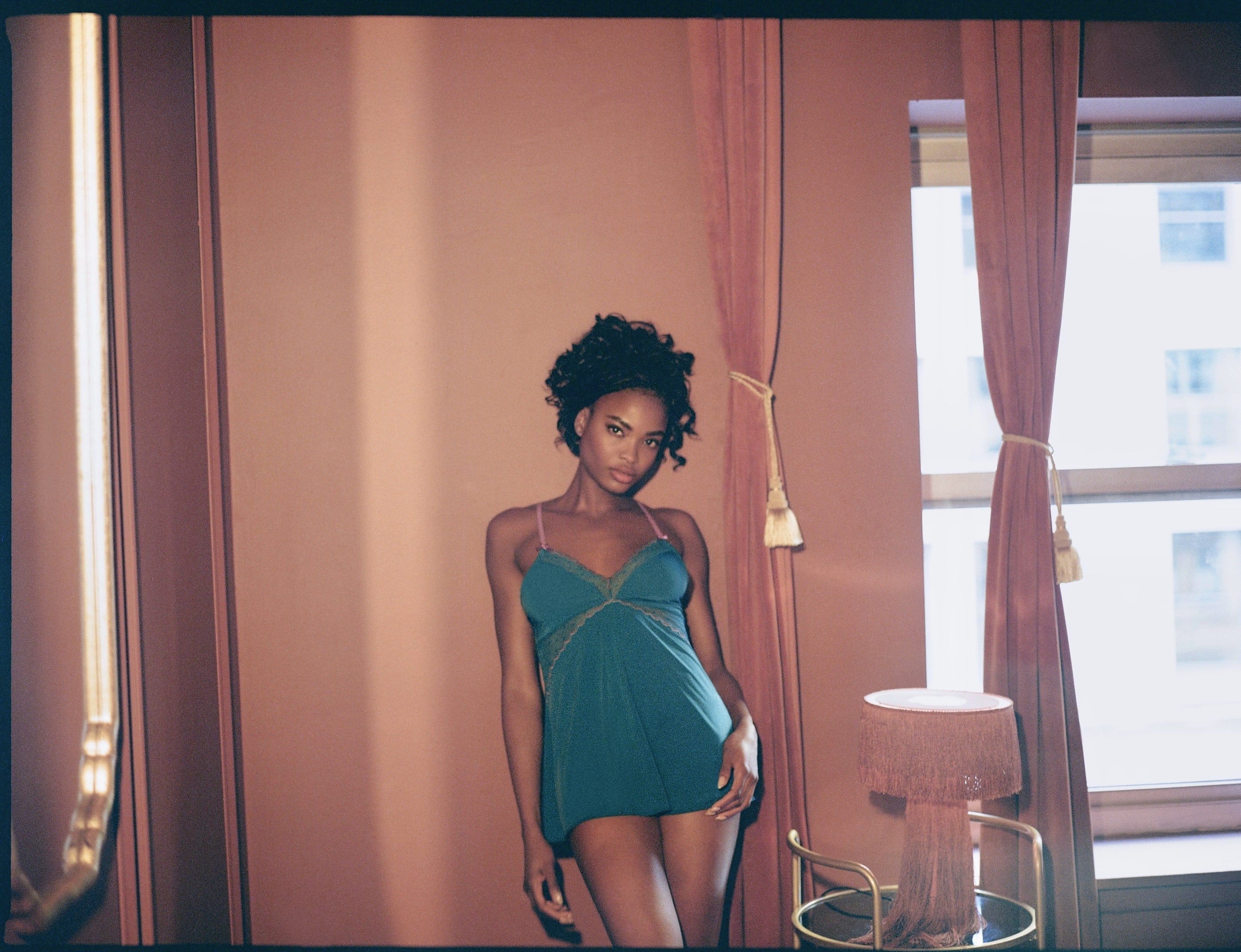 Model in teal blue babydoll slip loungewear