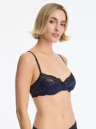 Skarlett Blue Captivate Satin & Lace Balconette Underwire Bra in Midnight/Black - model three-quarter view in satin jacquard bra with floral lace cups