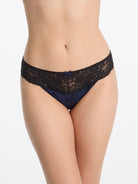 Skarlett Blue Captivate Satin & Lace Bikini in Midnight/Black - model close-up front view in satin bikini underwear with floral lace and bow