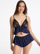 Skarlett Blue Captivate Satin & Lace Flutter Cami and Captivate Satin Flutter Short in Midnight - model front view in satin jacquard cami and sleep shorts with lace cups