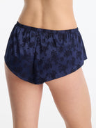 Skarlett Blue Captivate Satin Flutter Short in Midnight - model back view in satin sleep shorts with jacquard floral texture