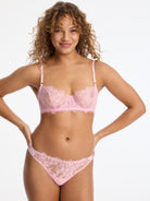 Skarlett Blue Entice Lace Balconette Bra and Entice Lace Front Thong in Strawberry Cream - model front view in lace balconette bra and thong with scalloped edges