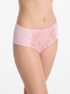 Skarlett Blue Entice Full Coverage Lace Brief in Strawberry Cream - model three-quarter view in full coverage brief with floral lace front panel