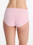 Skarlett Blue Entice Full Coverage Lace Brief in Strawberry Cream - model back view in full coverage brief with smooth back and ruched center seam